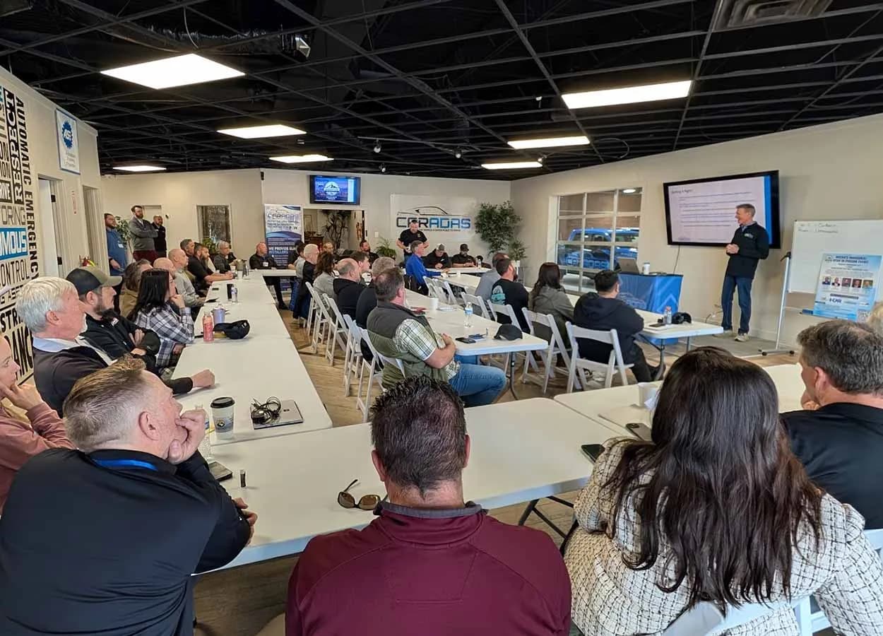 presenter leading an ADAS session for collision repair professionals